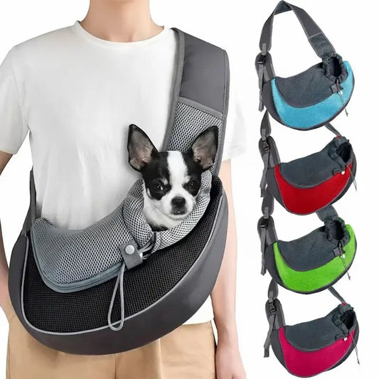 Person carrying a small dog in a gray pet sling with color options displayed on the side.